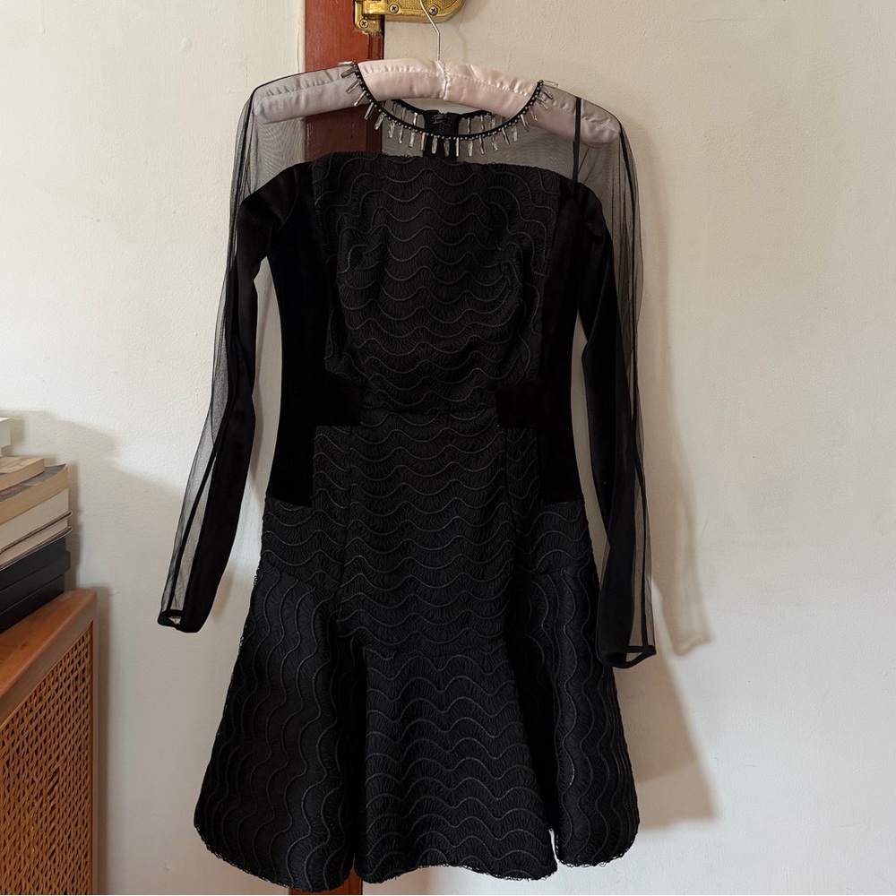 Arzu Kaprol Atelier black cocktail dress.